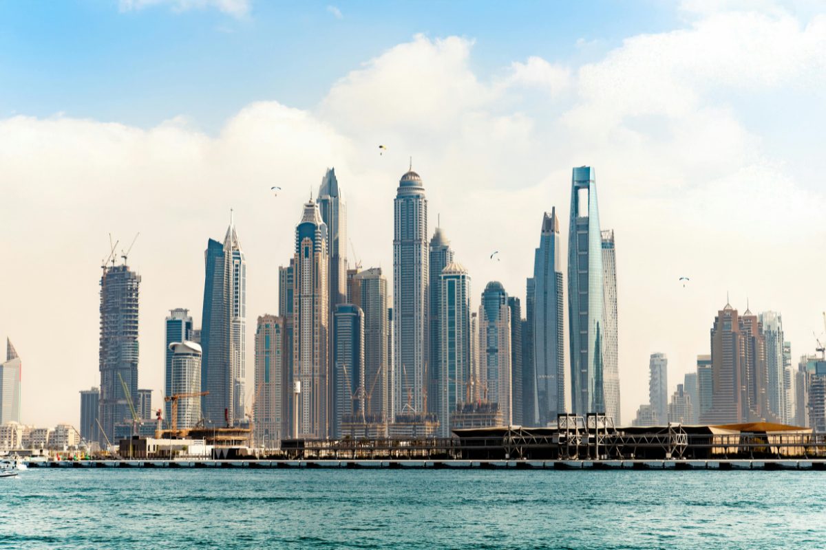 Dubai off-plan development render beside rising modern towers